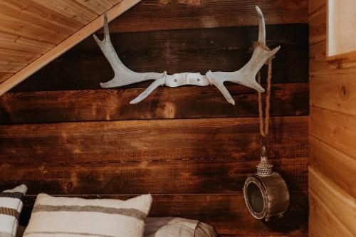a room with a wall with antlers on it at Treehouse on the Water -Eagles Nest-20 ft high in Port Angeles