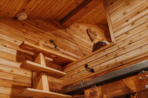 a ceiling of a wooden room with a mirror at Treehouse on the Water -Eagles Nest-20 ft high in Port Angeles