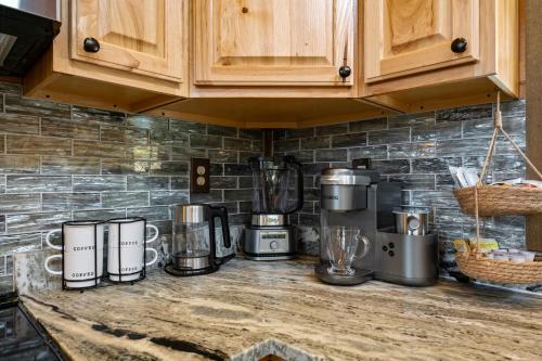 a kitchen counter with appliances on top of it at The Overlook - '21 Cabin - Gorgeous Unobstructed Views - Fire Pit Table - GameRm - HotTub - Xbox - Lots of Bears in Gatlinburg