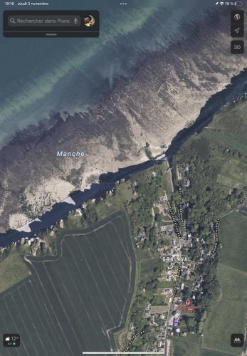 a satellite view of the ocean and a beach at Chalet les falaises in Saint-Léonard