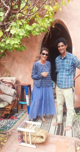 a man and a woman standing in a doorway at Maison d'Hôtes Irocha in Tisselday
