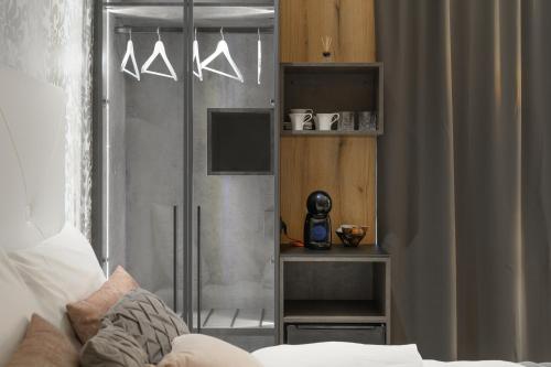 a room with a bed and a glass door at ROYAL SUITE, Ljubljana in Ljubljana