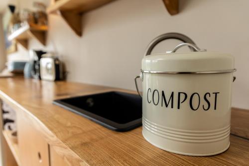 a can of compost sitting on a kitchen counter at Aiteall Bed and Breakfast in Liscannor