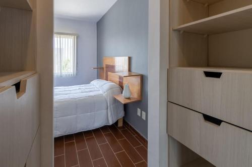 Ένα ή περισσότερα κρεβάτια σε δωμάτιο στο Casa de lujo en Aguascalientes