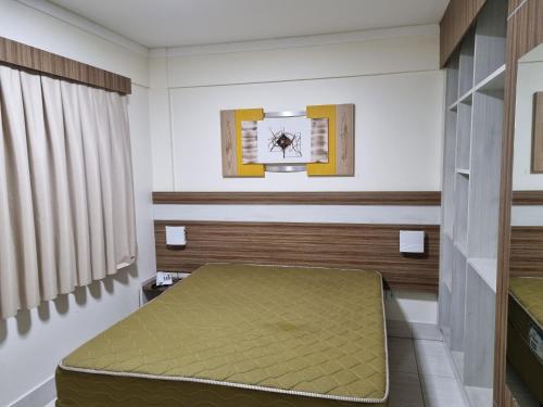 a small room with a bed and a window at Lacqua Diroma Parque - I - II -III - IV - V in Caldas Novas