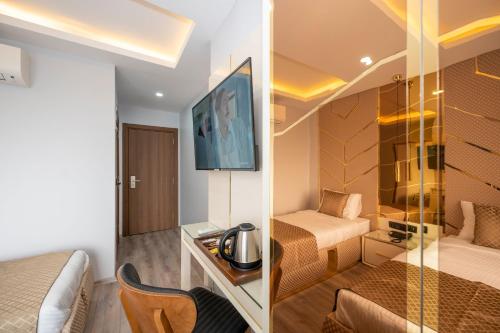 two pictures of a hotel room with a bedroom at Luxury Airport Hotel By Zazzoni-İstanbul Airport in Arnavutköy