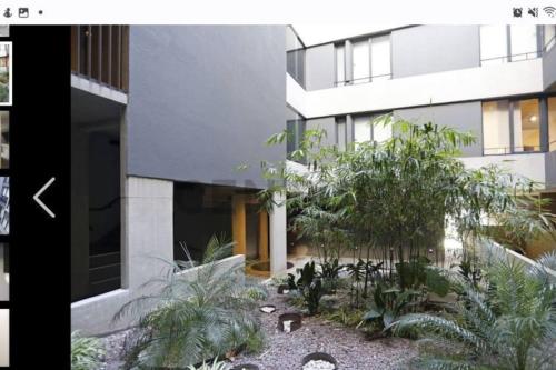 una representación de un edificio con jardín en Dpto de 1 dormitorio y 1.5 baños con amenities en Belgrano R Villa Urquiza en Buenos Aires
