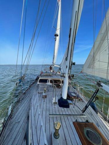a sail boat in the ocean with the sky at Classic sailing ship in center of Enkhuizen! in Enkhuizen