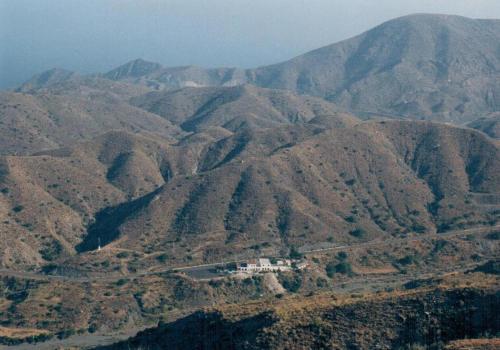 an aerial view of a mountain range with a house at Pensión Restaurante Venta El Molino in Sopalmo