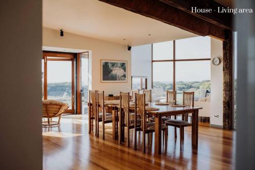 a dining room with a table and chairs at Miramar Beach House in Seymour