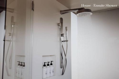 a shower in a bathroom with a shower curtain at Miramar Beach House in Seymour