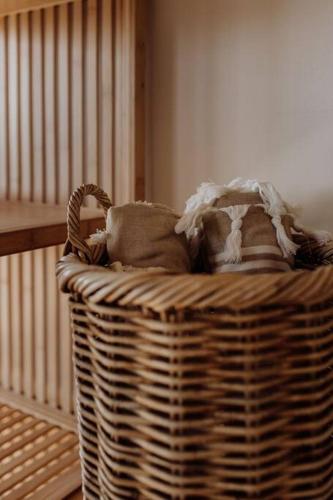 a wicker basket with pillows in a room at Miramar Beach House in Seymour