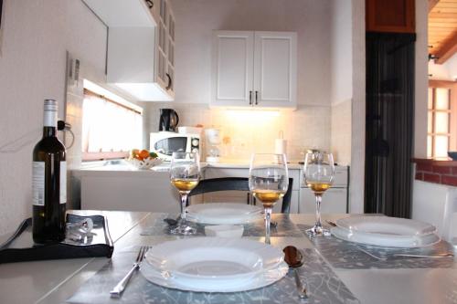 a kitchen with two glasses of wine on a counter at Lily's lovely apartments in Fažana