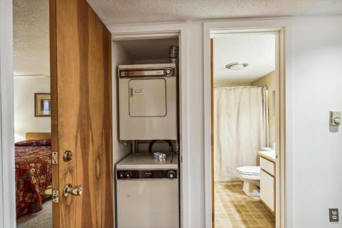 a small bathroom with a sink and a toilet at Pinnacle A11 in Killington
