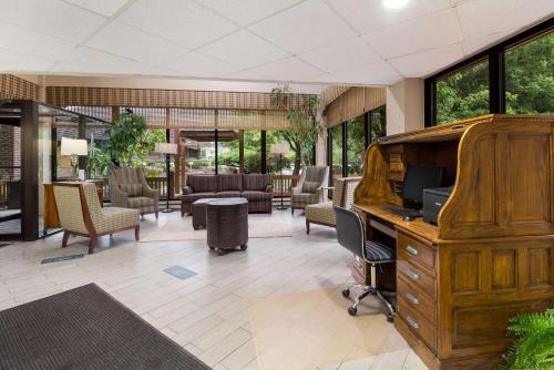 an office with a desk with a computer and chairs at Best Western Braddock Inn in La Vale