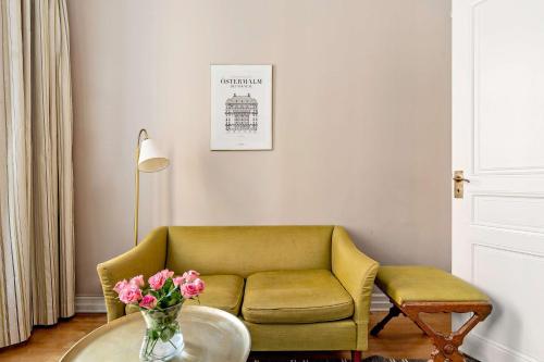 a living room with a couch and a table at Hotel Esplanade, BW Signature Collection in Stockholm
