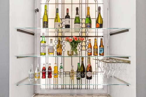 a wine rack filled with bottles and glasses at Hotel Esplanade, BW Signature Collection in Stockholm