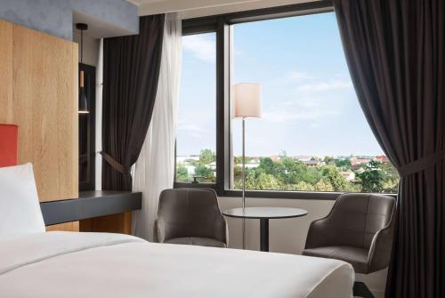 Postel nebo postele na pokoji v ubytování Ramada by Wyndham Slatina Parc