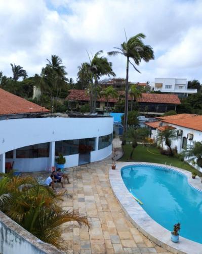 arial view of a resort with a swimming pool at Por do Sol Pousada Praia in São Luís