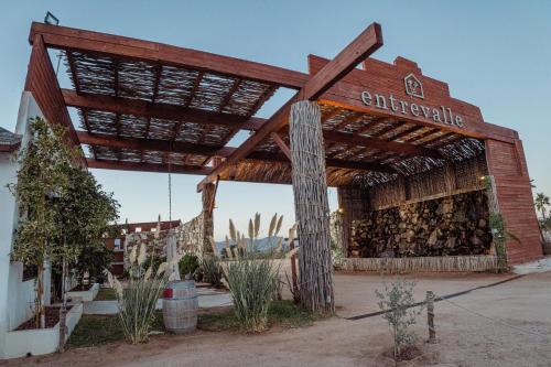 an old building with a sign on the side of it at Entrevalle Hotel Boutique in Valle de Guadalupe