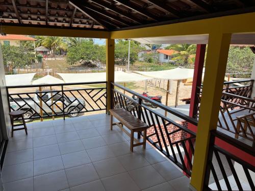 a balcony with a view of a playground at Pousada Solar Maia Costa in Atins