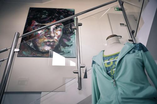 a mannequin in a display case with a painting at Rosa Bed and Breakfast in Podgorje