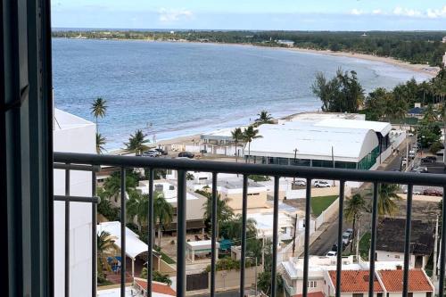 a view of the beach from a balcony at Cozy Oceanview Studio w parking in San Juan