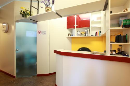 a kitchen with a counter and a refrigerator at Albergo Al Carugio in Monterosso al Mare