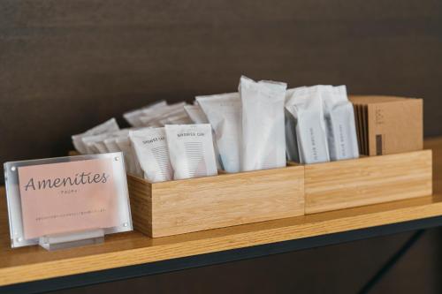 a wooden shelf with books on top of a table at Hotel JAL City Haneda Tokyo in Tokyo
