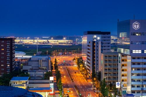 a view of a city at night with buildings at Hotel JAL City Haneda Tokyo in Tokyo