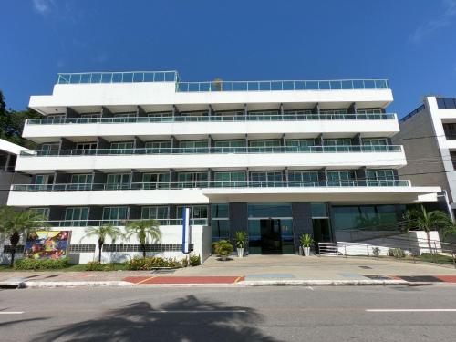 a large white building with a lot of windows at Blue Sunset Prime com vista para mar in João Pessoa