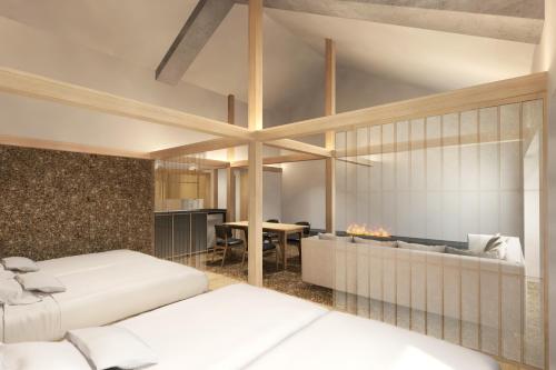 a bedroom with two beds and a fireplace at Kyoto ITOYA Hotel Mon in Kyoto
