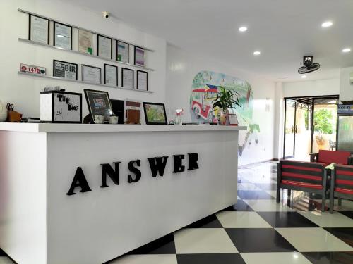 an answer store with a checkered floor at Answer hotel in Puerto Galera