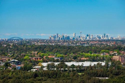 a view of a city with a bunch of buildings at Panoramic City View 3bed2bath condo Wi-Fi Parking in Sydney