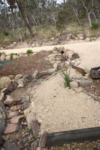 a rock garden with a path in the middle at Glen Lough Cabins in Glen Aplin