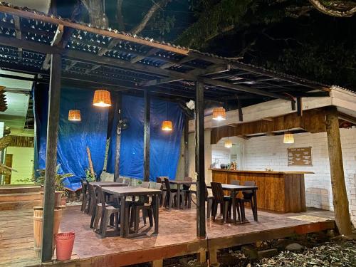 a group of tables and chairs on a patio at Hotel Sebastian Panglao in Bolod