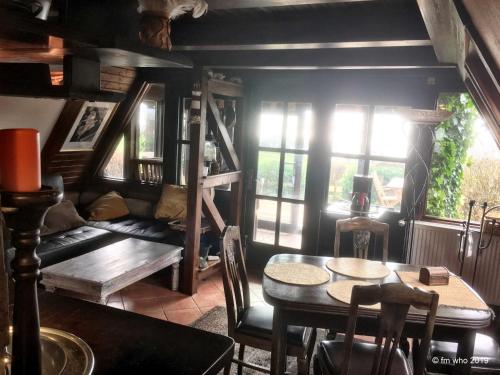 a living room with a couch and a table at Hoefthus 1 in Alt Reddevitz