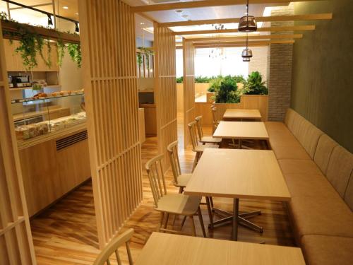 a row of tables and chairs in a restaurant at The Legato Inn MIFUNE in Mifune