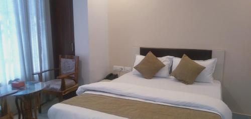 Hotel Success Residencyにあるベッド