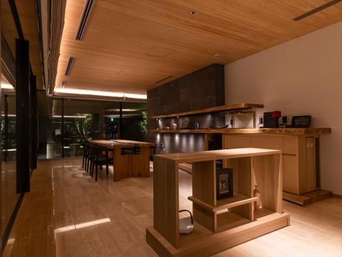 a kitchen with a table and a counter top at THE BLOSSOM KUMAMOTO in Kumamoto