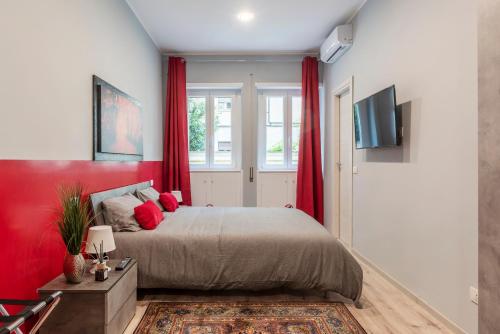 A bed or beds in a room at Clodia Apartments