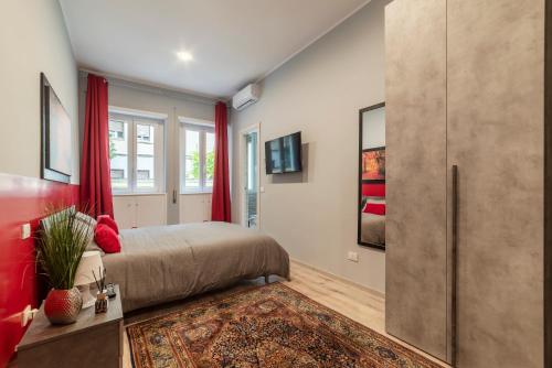 A bed or beds in a room at Clodia Apartments