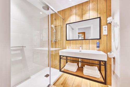 a bathroom with a sink and a shower at Barcelona Century Hotel in Barcelona