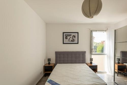 Postel nebo postele na pokoji v ubytování Borely - appartement avec terrasse