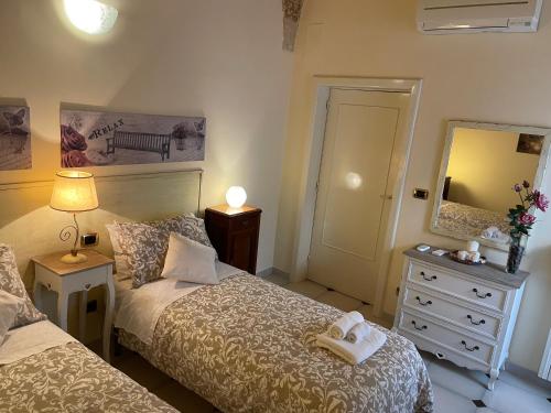 Posteľ alebo postele v izbe v ubytovaní Porta Piccola B&B