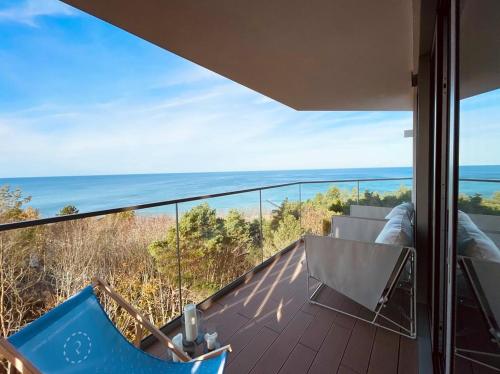 a view of the ocean from the balcony of a house at PINEA Apartments Pobierowo z niesamowitym widokiem na morze oraz jacuzzi w wybranych apartamentach in Pobierowo