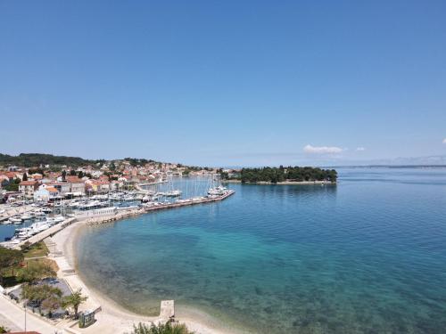 an aerial view of a beach with boats in the water at Beachfront apartments Calm Sea in Preko