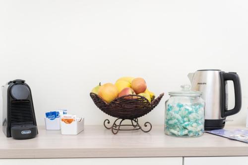 a basket of fruit sitting on top of a counter at Zaira b&b in Rome