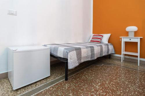 a small bed in a corner of a room at Zaira b&b in Rome
