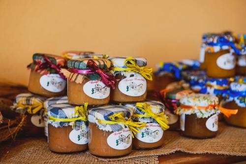 a group of honey jars with bows on them at Borgo Monachella in Ragusa